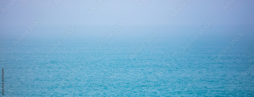 Expanse of water on the sea with a foggy horizon
