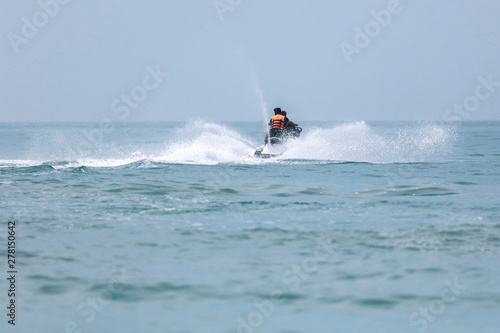 Jet ski at speed in a spray of water