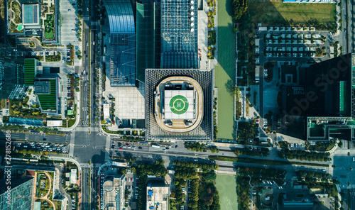 Photos Aerial drone view of helipad on the roof of a skyscraper iin downtown with citys