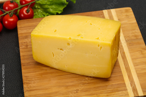 Hard yellow tasty cheese brick