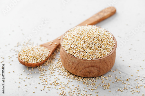 Bowl of healthy white quinoa seeds. photo