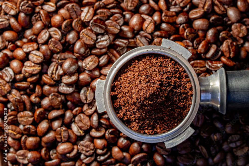 Fototapeta premium coffee beans grinder in group head coffee machine