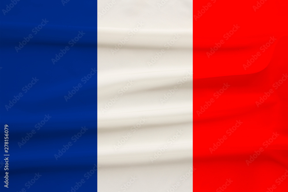 national flag of the country france on gentle silk with wind folds, travel concept, immigration, politics, copy space, close-up