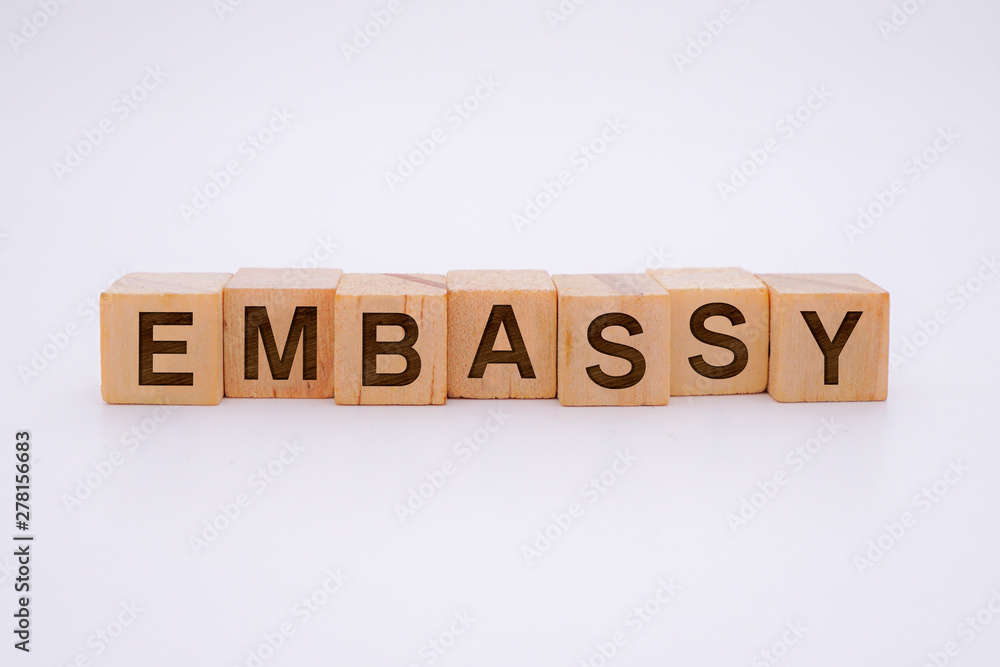 Embassy Word Written In Wooden Cube With White Background Concept Embassy Word Written In Wooden Cube With White Background Concept