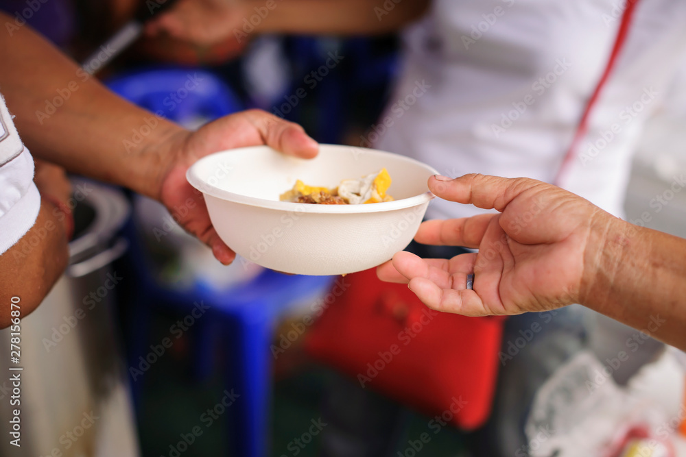 Free food for the poor and Food distribution : concept Sharing Food With Homeless Free food for the poor and Food distribution : concept Sharing Food With Homeless