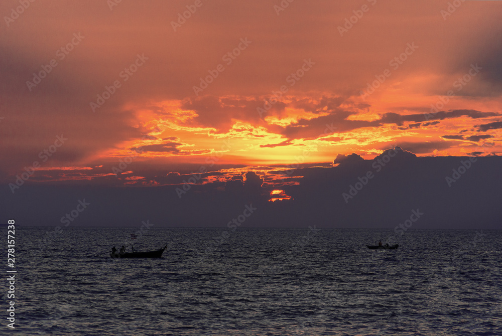 Two boats in the sea at sunset, Pattaya Thailand