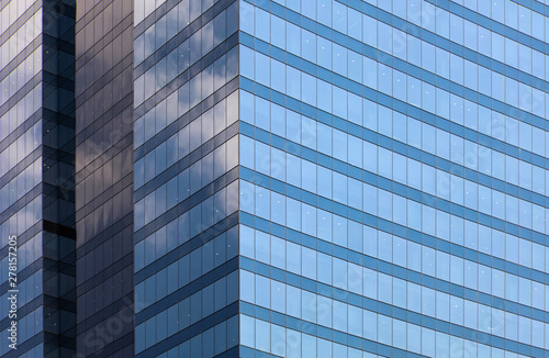 blue glass office building facade background day view