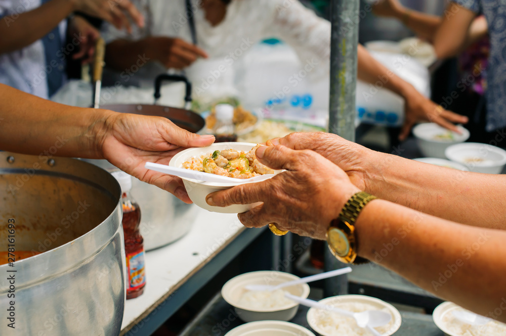 concepts of poverty in Asian society : Volunteers Share Food to the Poor to Relieve Hunger