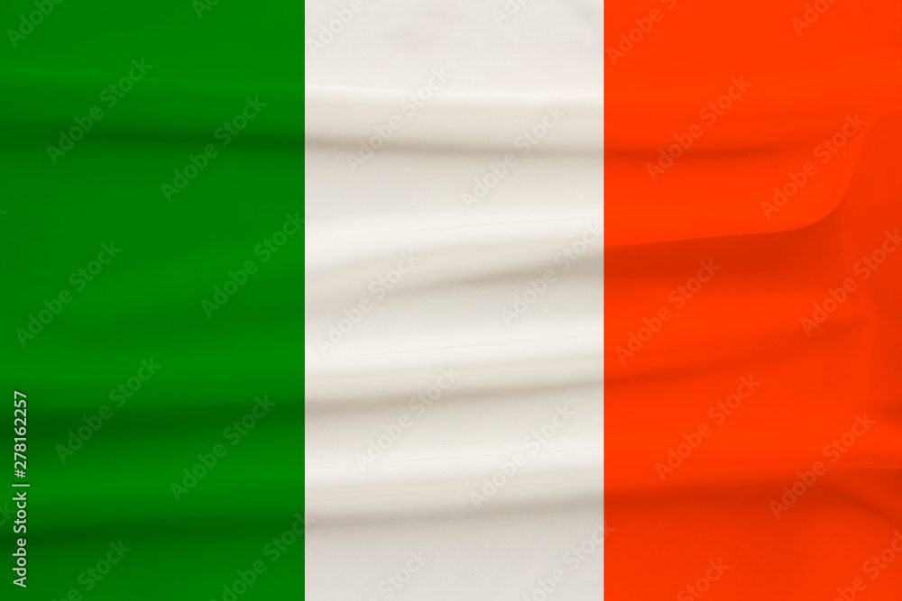 national flag of the country ireland on delicate silk with wind folds, travel concept, immigration, politics, copy space, close-up