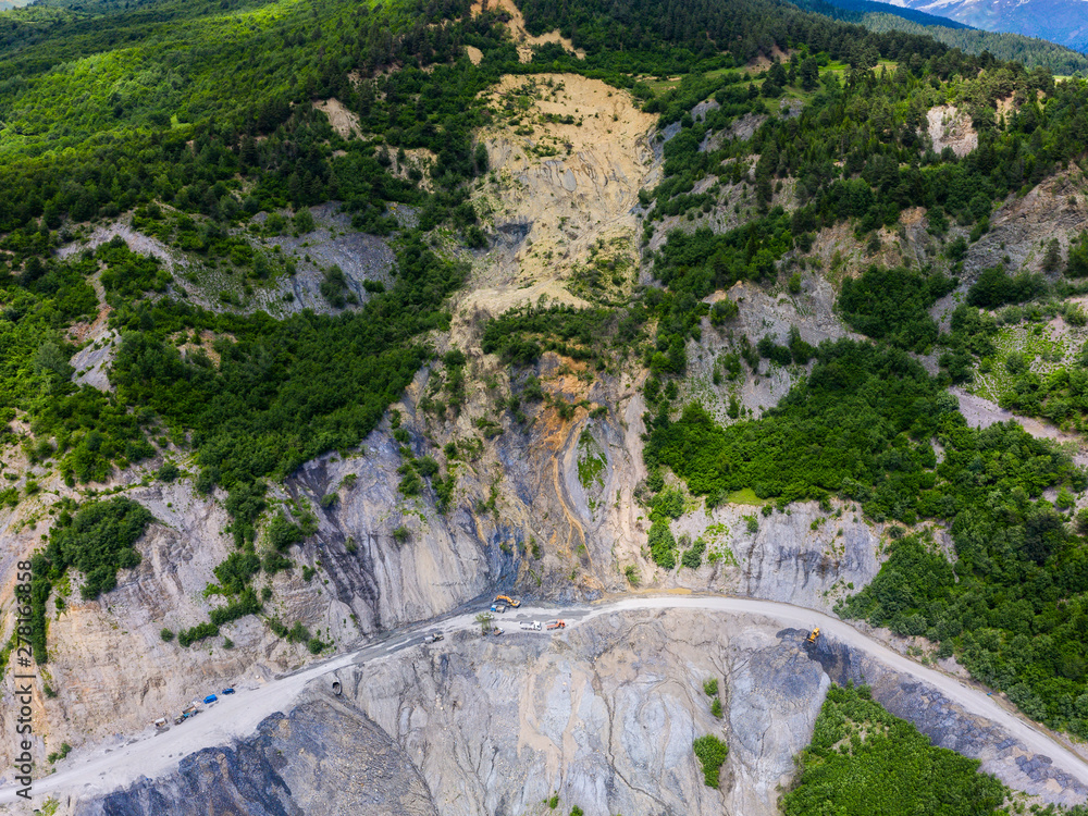 Amazing view of the landslide on a mountain road. The road from Mestia to Zugdidi was blocked by an rockfall. Road services are clearing the mountain road serpentine.