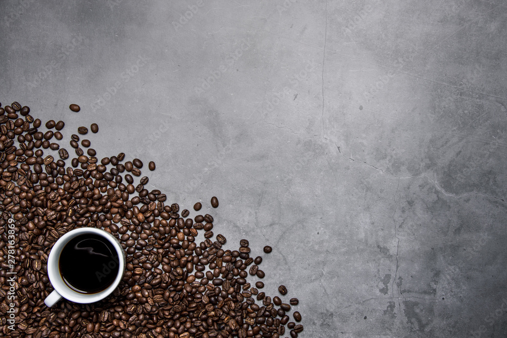 cup of coffee and beans on concrete background cup of coffee and beans on concrete background