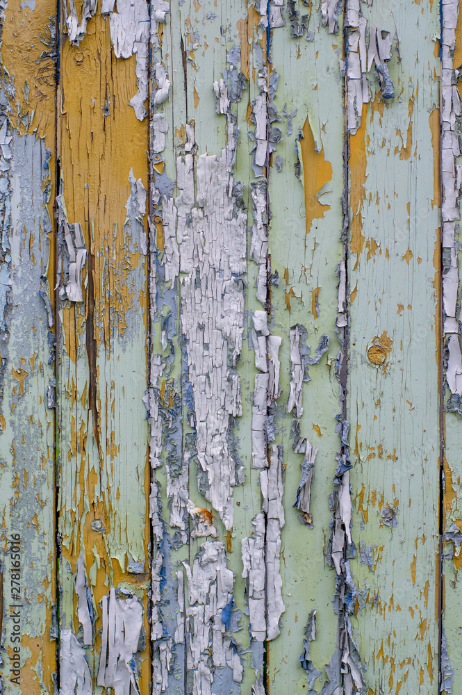 Multicolored bright old planks with cracked paint