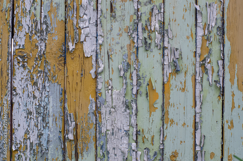 Multicolored bright old planks with cracked paint Multicolored bright old planks with cracked paint