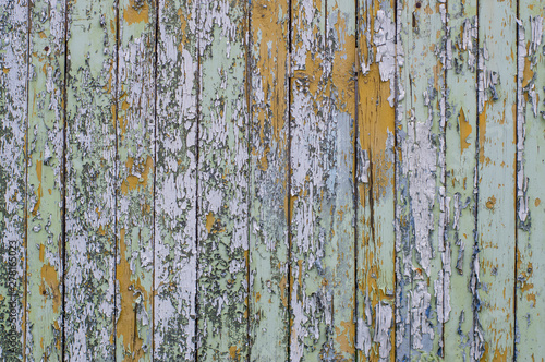 Multicolored bright old planks with cracked paint