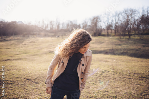 Lifestyle image of young woman walking outdoors