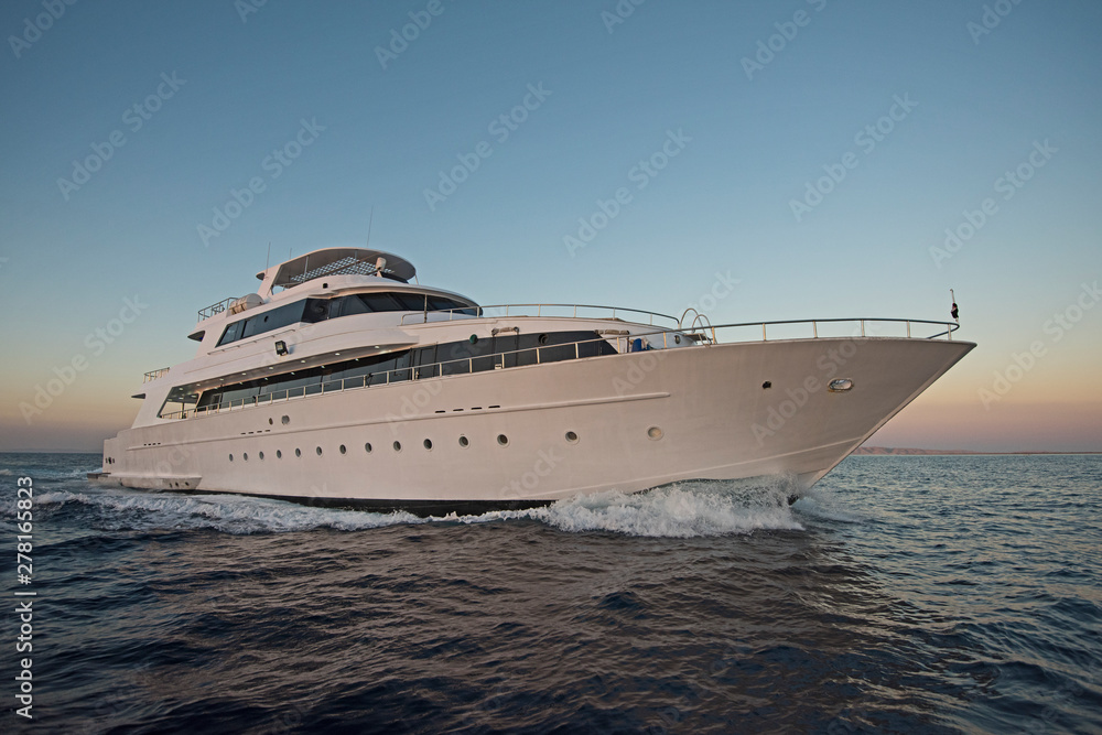 Luxury private motor yacht sailing at sea Luxury private motor yacht sailing at sea