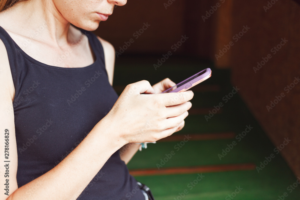 Cute young girl texting with her mobile phone Cute young girl texting with her mobile phone
