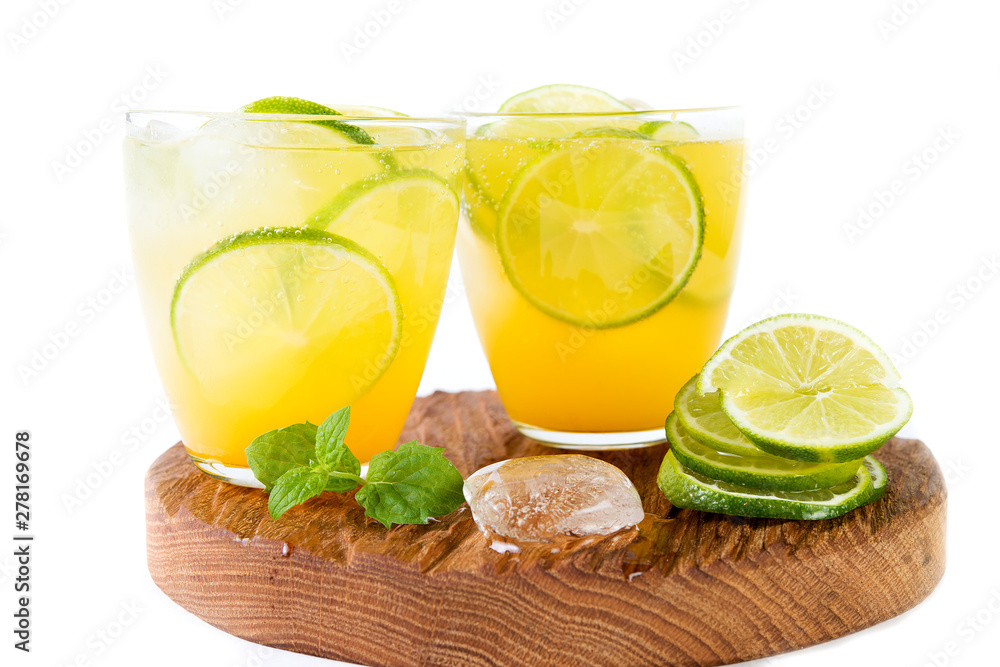 Natural orange lemonade with citrus and mint on white background. Detox drink for a healthy lifestyle. Natural orange lemonade with citrus and mint on white background. Detox drink for a healthy lifestyle.