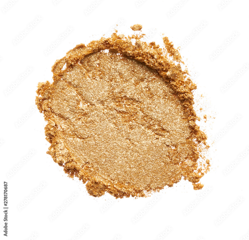 Texture of gold eye shadow isolated on white background. Macro texture of broken gold powder Texture of gold eye shadow isolated on white background. Macro texture of broken gold powder