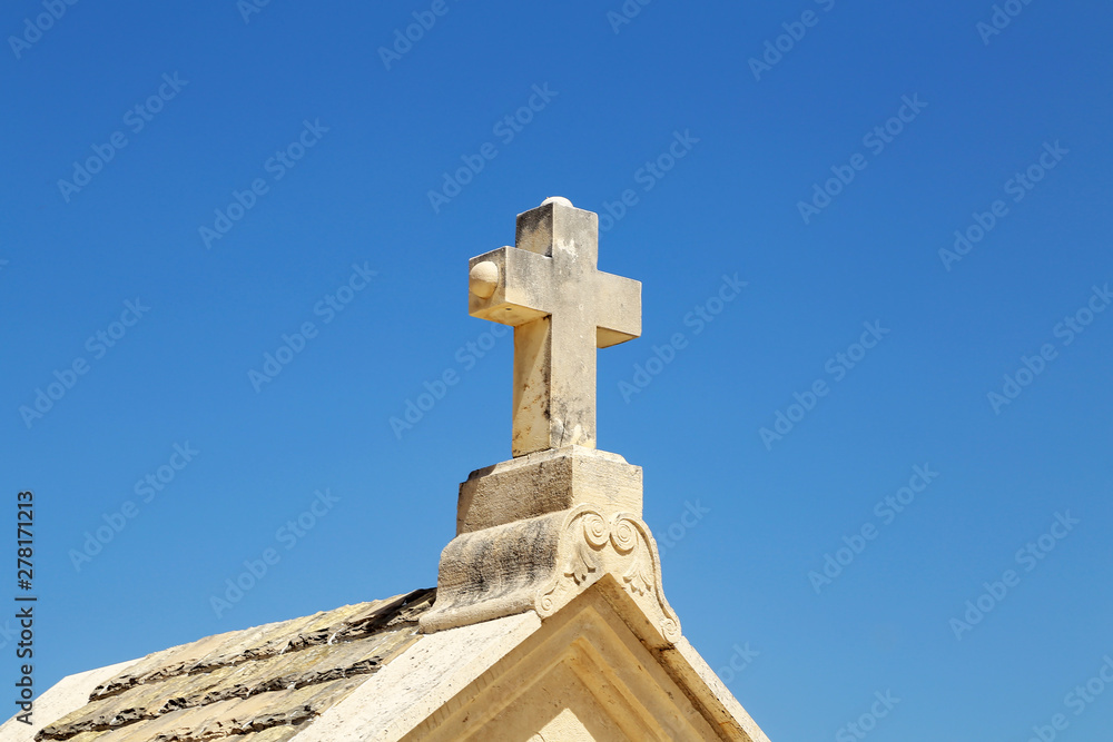 Stone cross at a chapel in Croatia