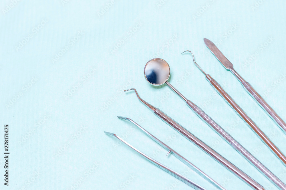 Dentist tools - probe, mirror, tweezers and drill Dentist tools - probe, mirror, tweezers and drill