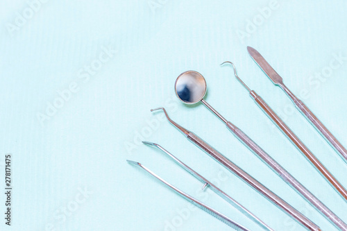Dentist tools - probe, mirror, tweezers and drill