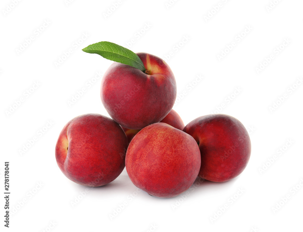 Delicious ripe peaches with leaf isolated on white Delicious ripe peaches with leaf isolated on white