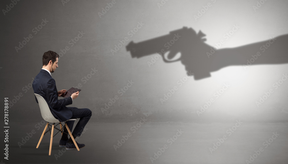 Small businessman staying and offering stuffs for an armed shadow hand Small businessman staying and offering stuffs for an armed shadow hand