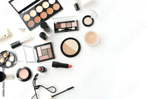 Makeup products, decorative cosmetics on white background flat lay . Fashion and beauty concept. Top view. Copy space.
