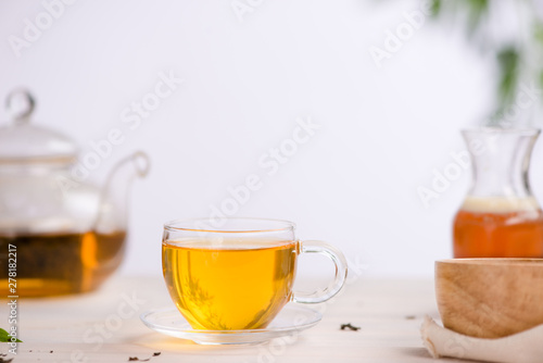 Dried tea leaves with tea pot