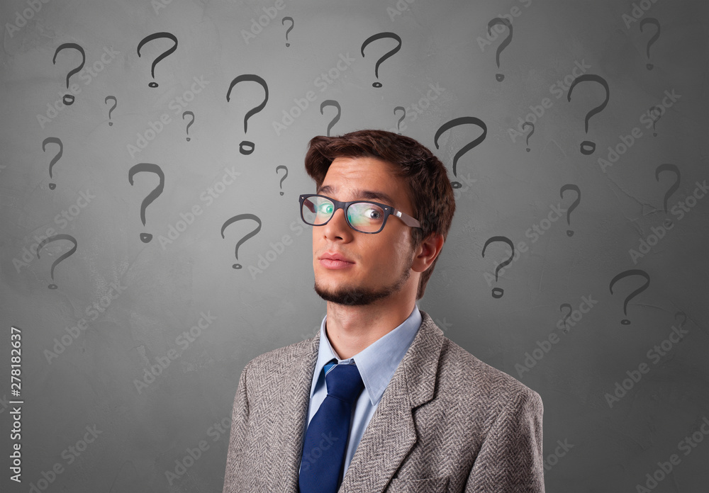 Person with question marks around face Person with question marks around face