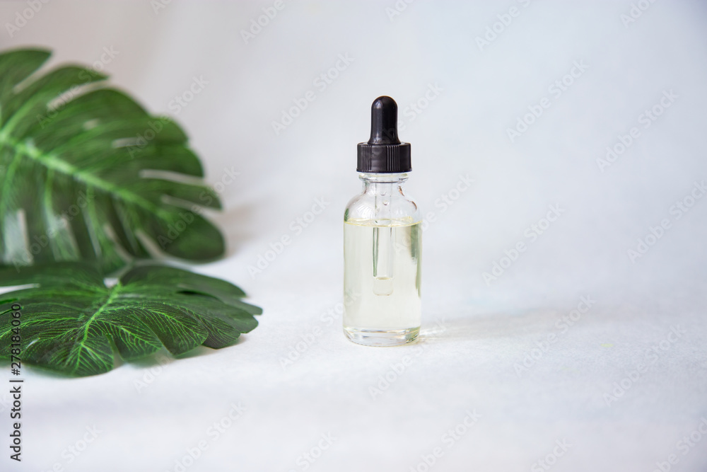 Dropper glass bottle with pipette. Mock up Essential liquid Dropper glass bottle with pipette. Mock up Essential liquid