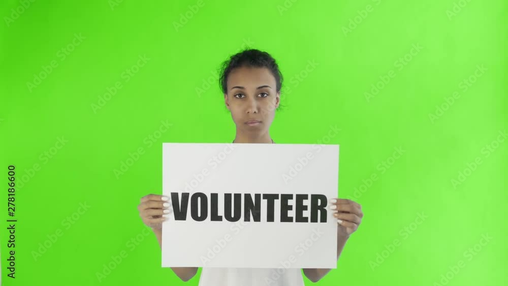 Afro-American Girl Activist With Volunteer Poster on chroma key background Afro-American Girl Activist With Volunteer Poster on chroma key background