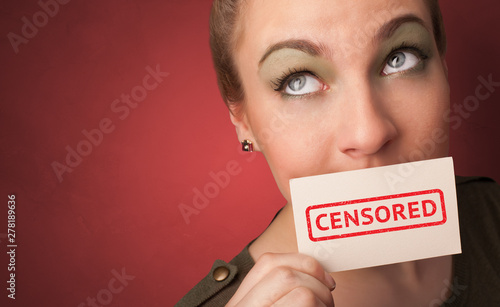 Young person holding adult content card in hand