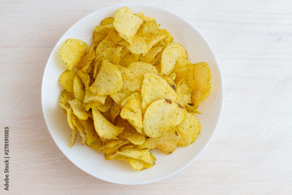 bowl of chips on white plate bowl of chips on white plate