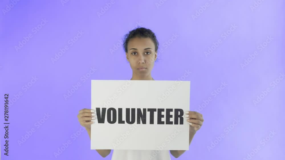 Afro-American Girl Activist With Volunteer Poster on Violet background Afro-American Girl Activist With Volunteer Poster on Violet background