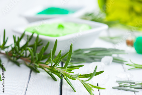 Wallpaper Mural cosmetic creams and rosemary on white wooden table Torontodigital.ca