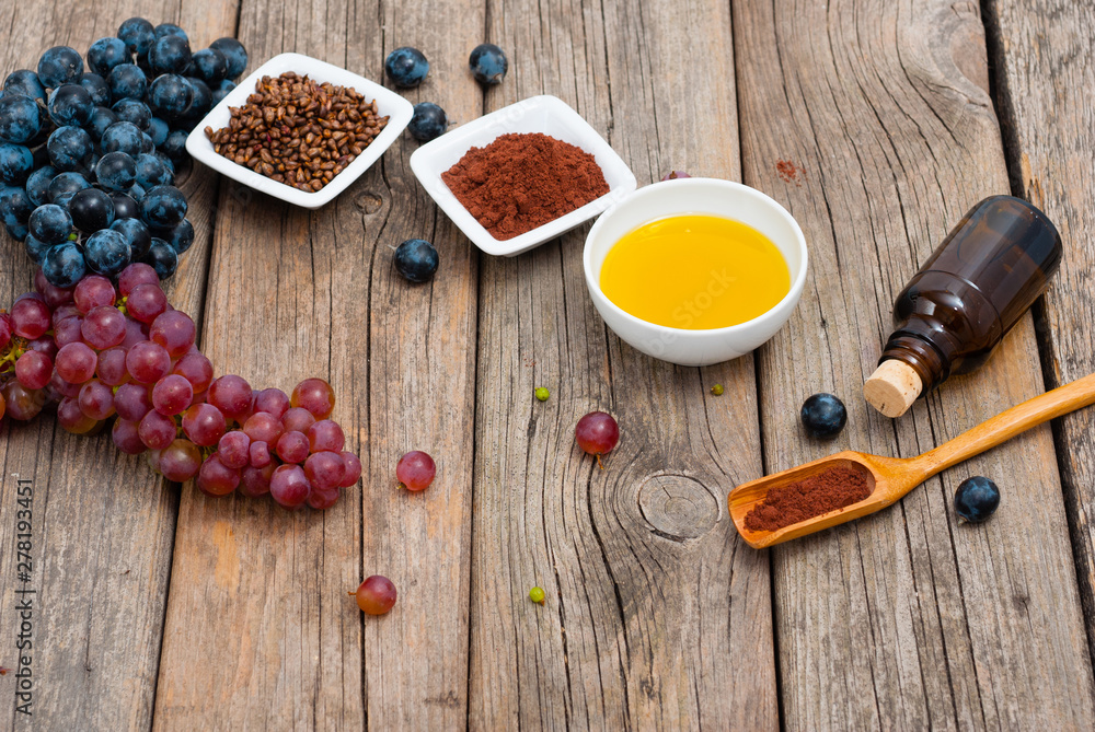 grape seed oil, grist and bunches on old wood grape seed oil, grist and bunches on old wood