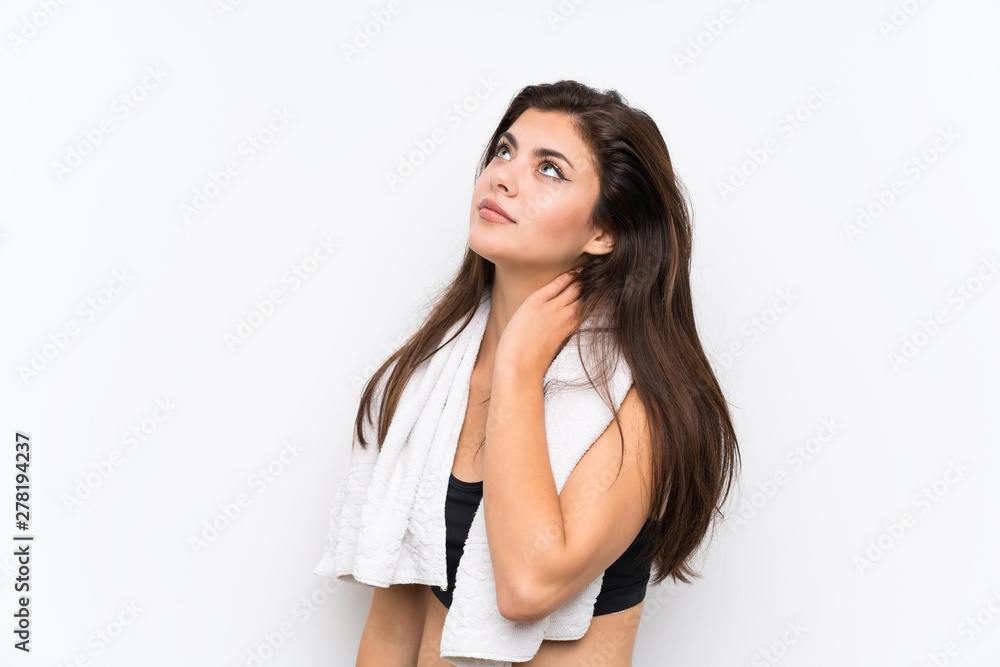 Teenager sport girl over isolated white background standing and thinking an idea Teenager sport girl over isolated white background standing and thinking an idea