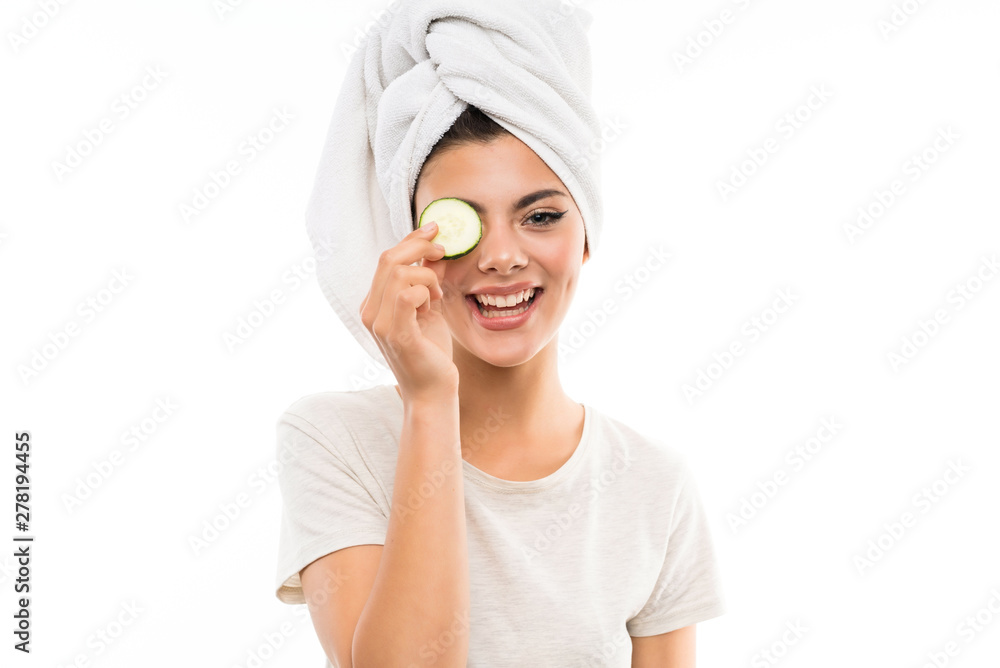 Beautiful young woman holding slices of cucumber. Beautiful young woman holding slices of cucumber.