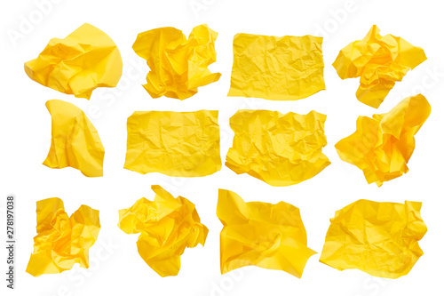 Close-up group of yellow crumpled paper isolated on a white background
