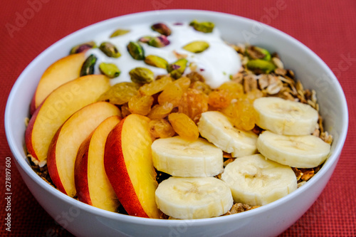 Healthy Vegetarian Breakfast Bowl of Muesli Fruit and Nuts With Yogurt