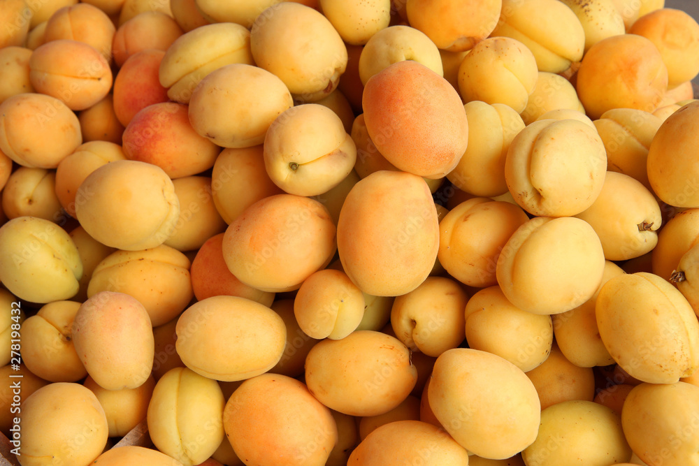 close up of fresh apricots as background close up of fresh apricots as background