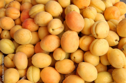 close up of fresh apricots as background