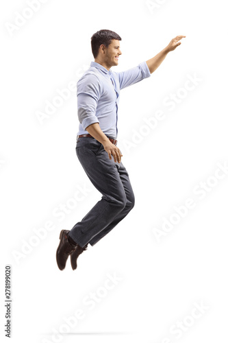 Professional young man jumping and gesturing with hand