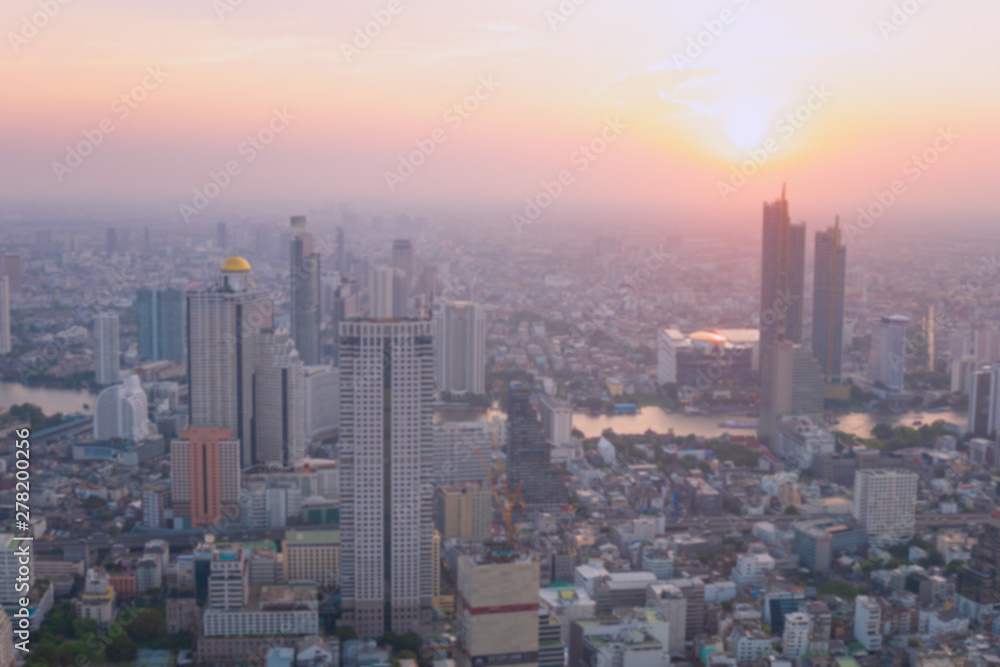 Blurred building/Background of cityscape concept: Blurred aerial view building big city on amazing golden warm light at sunrise /