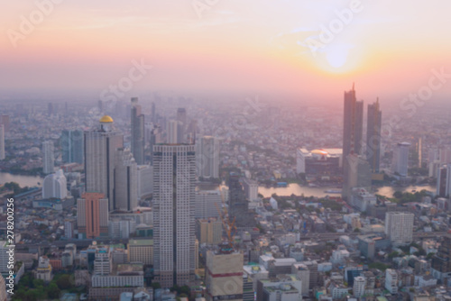 Blurred building/Background of cityscape concept: Blurred aerial view building big city on amazing golden warm light at sunrise / © LOVEis