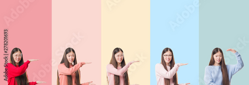 Collage of beautiful asian woman over colorful stripes isolated background gesturing with hands showing big and large size sign, measure symbol. Smiling looking at the camera. Measuring concept.