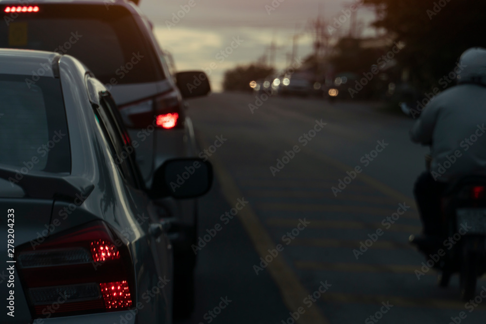 Bulled of cars and motorcycle on the road with light break at crossroad. Car open light brake. Bulled of cars and motorcycle on the road with light break at crossroad. Car open light brake.