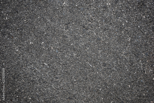 A smooth dark grey asphalt pavement texture with small rocks,Asphalt Dark Texture for Roads,Soil texture background